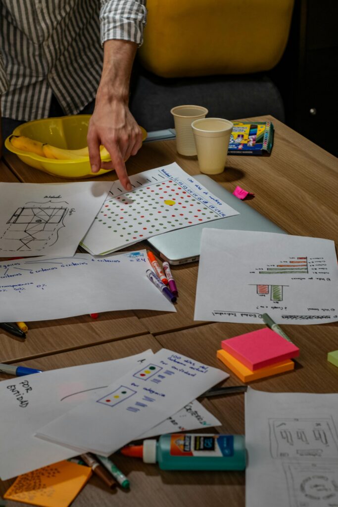 A detailed view of an office brainstorming session with notes and stationery.