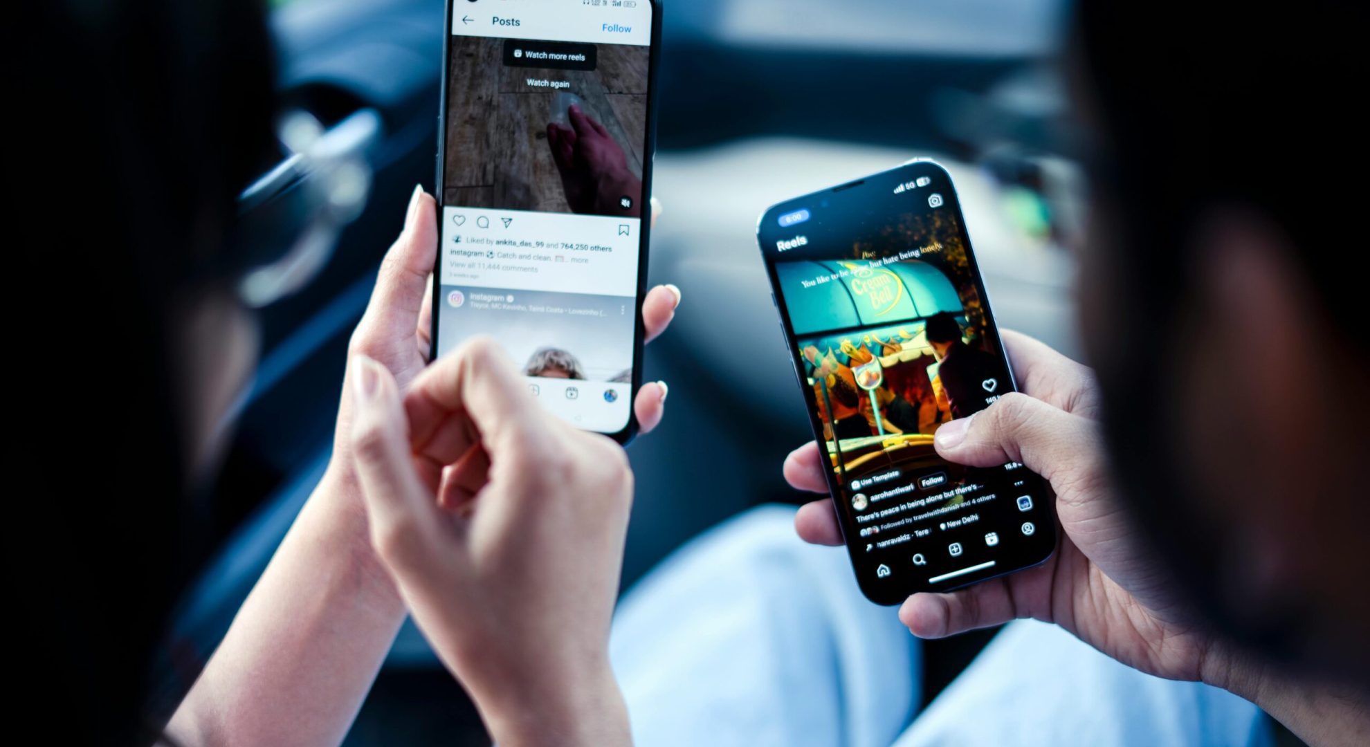 A couple engaging with social media on smartphones indoors, illustrating modern digital connectivity.